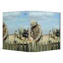 A US Marine prepares howitzer rounds to be fire Vinyl Binders