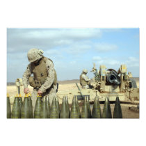A US Marine prepares howitzer rounds to be fire