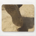 A US soldier walks along a dirt path Mousepad