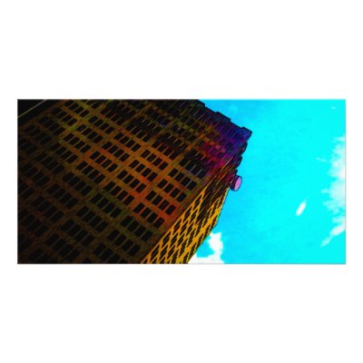A vibrant and tall building against the  blue sky photo card by stanthos