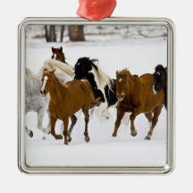 A winter scenic of running horses on The Christmas Tree Ornament