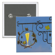 A wrought iron sign that illustrates the theme pinback buttons