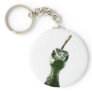A young peacock's head peering over to say hi! keychain