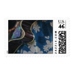 Acoustic Guitar Edge Against Blue Flower Dress Postage