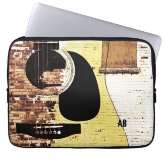 acoustic guitar on brick collage computer sleeves
