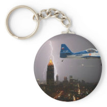 Aerobatic airplane in lightning key chains