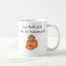basic_mug - An adorable African American baby sits inside an orange pumpkin and kid style text reads "Just arrived in time for Halloween!" on babys 1st Halloween T-shirts, tote bags, magnets, and more.: Sizes  Available colors: white