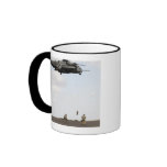 Air Force pararescuemen conduct a combat insert Mug