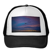 Airplane on multicoloured sky mesh hats