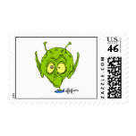 Alien with Giant Head driving UFO Postage Stamp