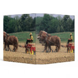Amish Country simple people in farming with binders