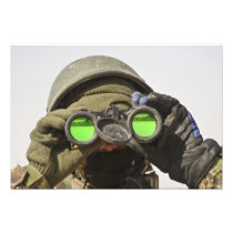 An Afghan soldier scans the horizon