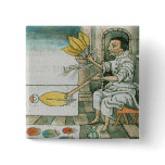 An Aztec feather artisan Pins