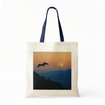 An eagles ascent tote bags