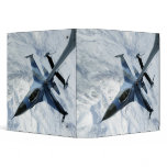 An F-16 Aggressor sits in contact position binders