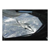 An F-22 Raptor banks away from a KC-135