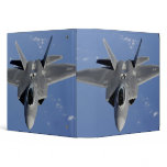 An F-22 Raptor moves into position to receive f 2 binders