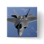 An F-22 Raptor moves into position to receive f 2 Button