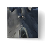An F-22 Raptor moves into position to receive f Buttons
