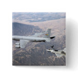 An F-22 Raptor receives fuel from a KC-135 Pins