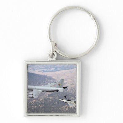 An F-22 Raptor receives fuel from a KC-135 Key Chains by stocktrek
