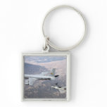 An F-22 Raptor receives fuel from a KC-135 Key Chains