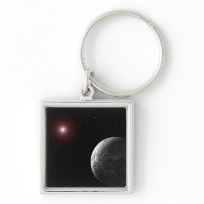 An icy/rocky planet orbiting a dim star key chains by stocktrek