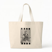An imprisoned angel tote bags