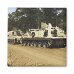 An M-88 recovery vehicle begins to tow an M992 Fridge Magnet