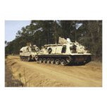 An M-88 recovery vehicle begins to tow an M992