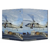 An MH-60S Seahawk prepares to deliver ammunitio 3 Ring Binder