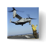 An MV-22 Osprey launches from the USS Nassau Button