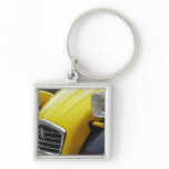 An old black and yellow Citroen 2CV 2 CV, detail Keychain