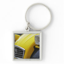 An old black and yellow Citroen 2CV 2 CV, detail Keychain