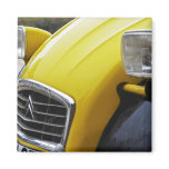 An old black and yellow Citroen 2CV 2 CV, detail Fridge Magnets