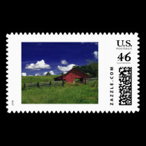 an old red barn on a hot summer day stamps