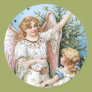 Angel Decorating the Tree Round Sticker Angel Decorating the Tree Round Sticker