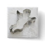 Angel shaped cookie cutter, with flour, close-up buttons