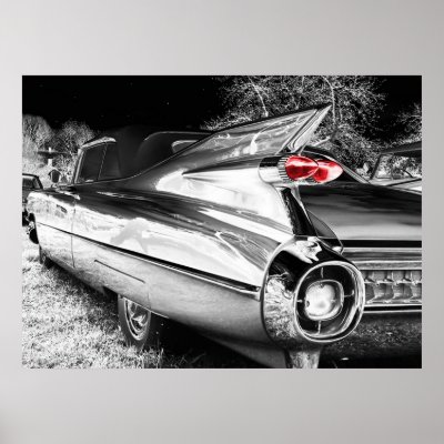 Antique black white car in chrome with a single red taillight