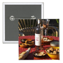 Aperitif and appetizers prepared: bread, olives, pinback buttons