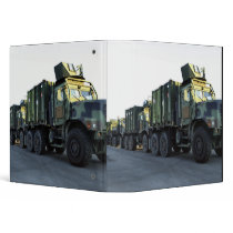 Armored trucks sit on the pier at Morehead City Binder