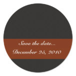 Artistic grey squares and rhombi's on black backgr round sticker