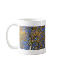 Aspen tree looking up through yellow leaves. coffee mugs