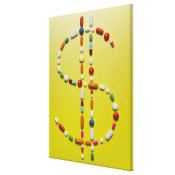 Assorted pills creating dollar symbol canvas print