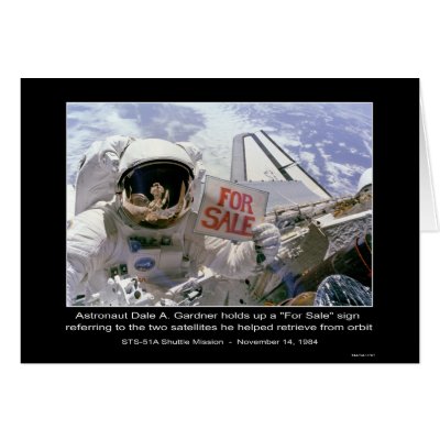 Astronaut Dale A. Gardner holds up a "For Sale" si Card by Space_Exploration