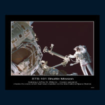 Astronaut Jeffrey N. Williams checks crane posters