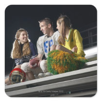 Athletes on bleachers square sticker