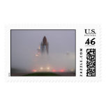 Atlantis in early dawn fog. postage