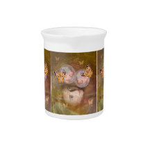 Baby boy or girl twins drink pitcher