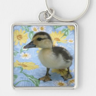 baby duckling on flowered background left key chain